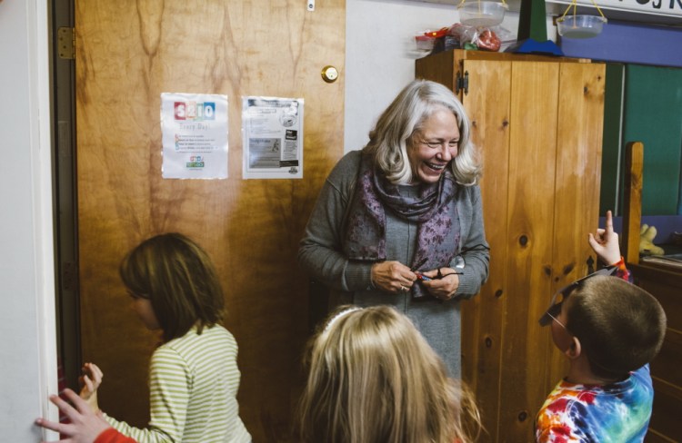 In this Jan. 6, 2015, photo teacher Nancie Atwell mingles as recess ends and students head to the rest of the day’s classes at the Center for Teaching and Learning, which she founded in the coastal town of Edgecomb. Atwell says teaching is “pure pleasure. It’s like eating dessert all day long.”