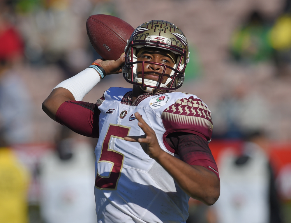 Florida State quarterback Jameis Winston, show in the Rose Bowl game on Jan. 1, declared himself eligible for the NFL draft Wednesday, with two years of college eligibility remaining. Also Wednesday, the woman who accused Winston of rape filed a lawsuit against the university saying it failed to properly investigate her allegations.