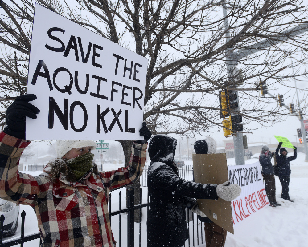 Demonstrators in Sioux Falls, S.D., protest the proposed pipeline. Lawsuits are being considered on behalf of Native American tribes in South Dakota.