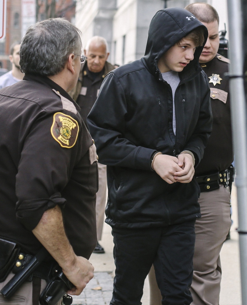 Justin Woodbury, shown during his initial court appearance on Dec. 18, denied terrorism charges on Thursday.