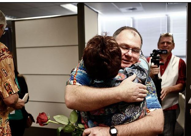Ross Griffith, right, is congratulated by Arlene Goldberg on Tuesday after Griffith married his partner in Fort Myers, Fla. The U.S. Supreme Court could decide as early as Friday to take up the issue.