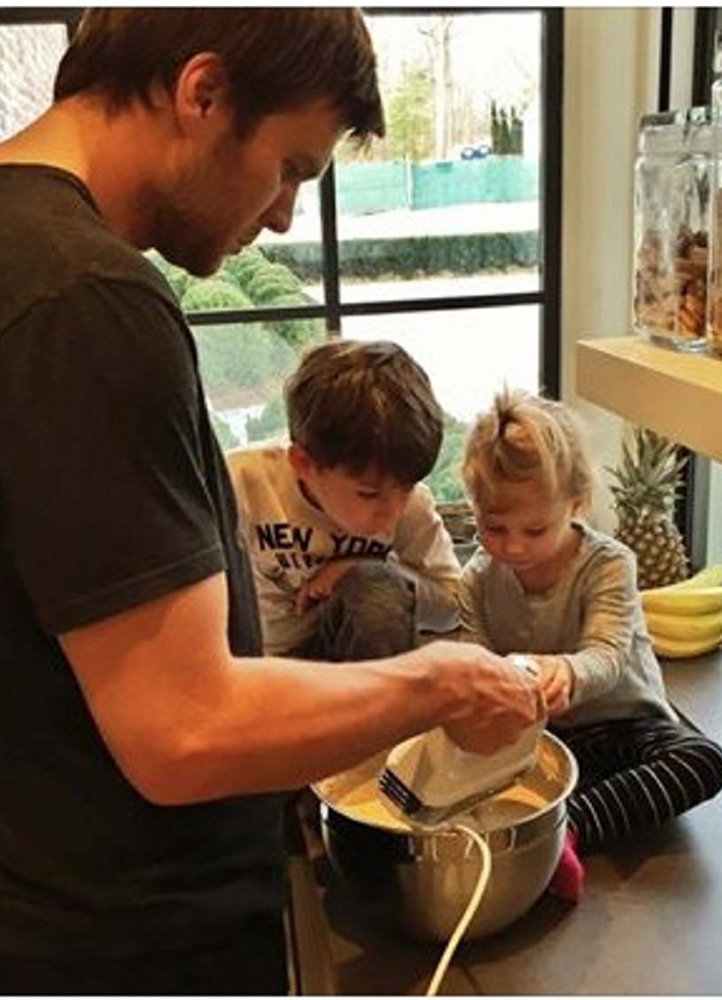 Tom Brady promotes healthy “gender norms” by making pancakes with his children in a snapshot posted on Facebook.