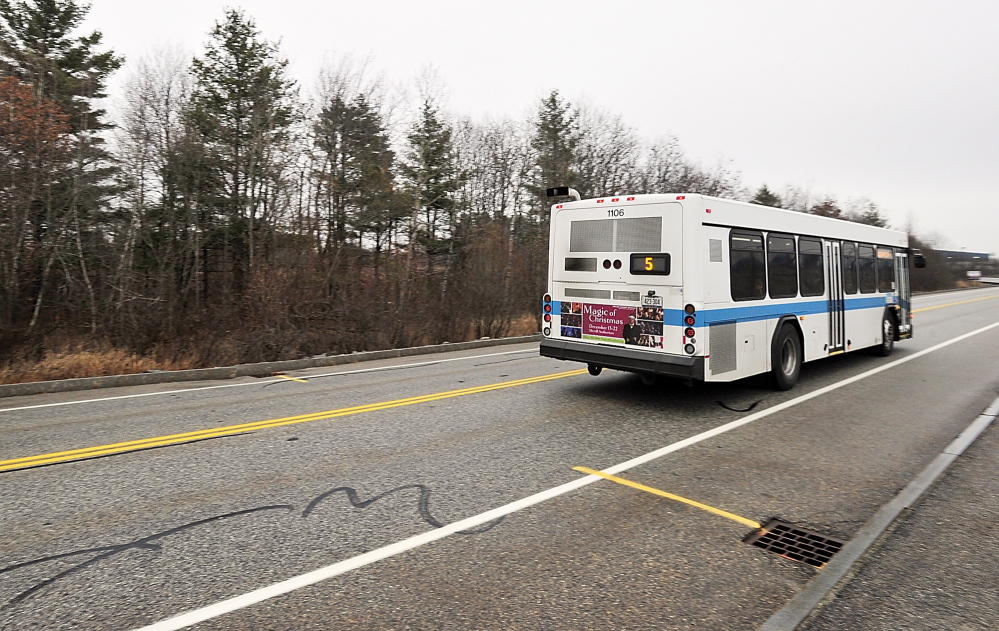 A Metro bus passes the entrance to the new DHHS building property near the Portland International Jetport in 2013. Changes to the bus route will cut the travel time from Portland in half, and open other opportunities for people to get around without a car. Gordon Chibroski/Staff Photographer