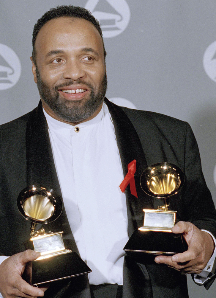 Andrae Crouch displays his two Grammys in 1995. He was a major force in contemporary gospel music.