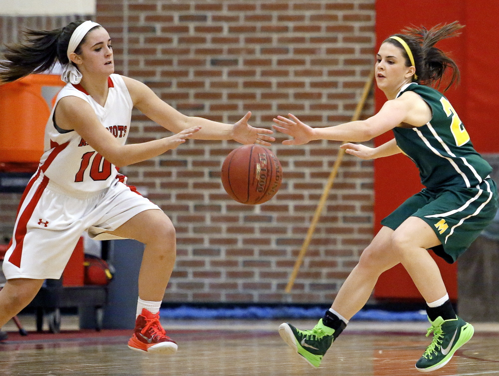 The ball is there for the taking, and Lydia Henderson of South Portland left, and Olivia Dalphonse of McAuley look to take it Friday night during their SMAA game at Beal Gym. Dalphonse’s defense on Henderson was one of the keys as the Lions improved their winning streak to nine with a 45-36 victory.