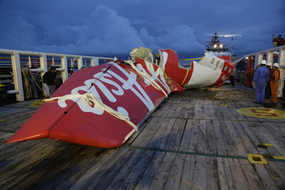 Parts of AirAsia Flight 8501 are seen on the deck of rescue ship Crest Onyx at Kumai port in Pangkalan Bun, Indonesia.