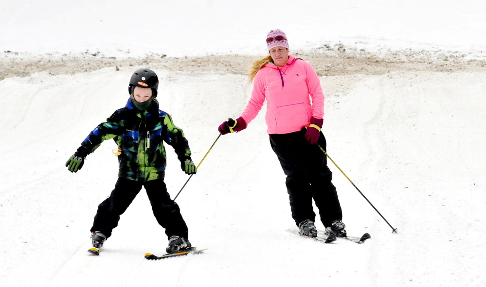 Bradie Castonguay of Waterville and her son, Ethan, enjoy Eaton Mountain Ski Area in Skowhegan, where a new rope tow has allowed ski trails to reopen.