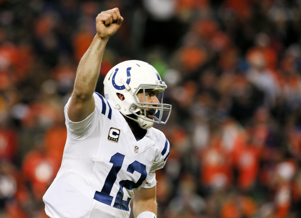 Indianapolis Colts quarterback Andrew Luck celebrates a touchdown pass against the Denver Broncos in the second half Sunday in Denver. The Associated Press