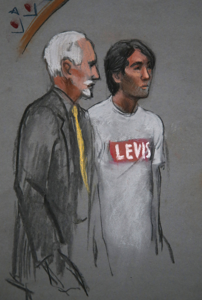 In this courtroom sketch, Khairullozhon Matanov, right, appears in court with his attorney Paul Glickman. Matanov is expected to plead guilty to repeatedly lying to authorities about contact he had with the Tsarnaev brothers.