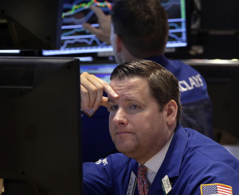 Trader Gregg Maloney works on the floor of the New York Stock Exchange. There was little good news Monday as U.S. crude oil hit $46.07 a barrel, which put a drag on stocks.