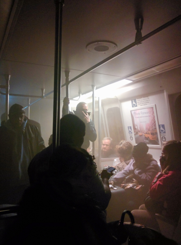 Smoke fills a Washington Metro system subway car near the L’Enfant Plaza station in Washington, Monday.