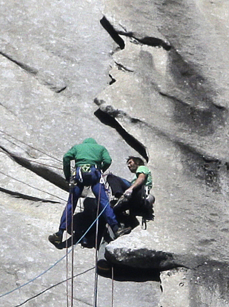 Tommy Caldwell, left, and Kevin Jorgeson approach the summit of El Capitan on Wednesday. The men started “free-climbing” to the 3,000-foot summit on Dec. 27, using no climbing aids other than ropes to prevent falls.