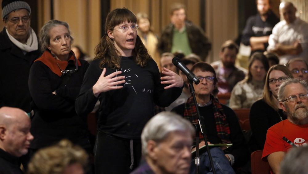 Monica Bowen, of Boston, asks a question during a public meeting Wednesday to mobilize efforts to keep the 2024 Summer Olympic Games from coming to the city.