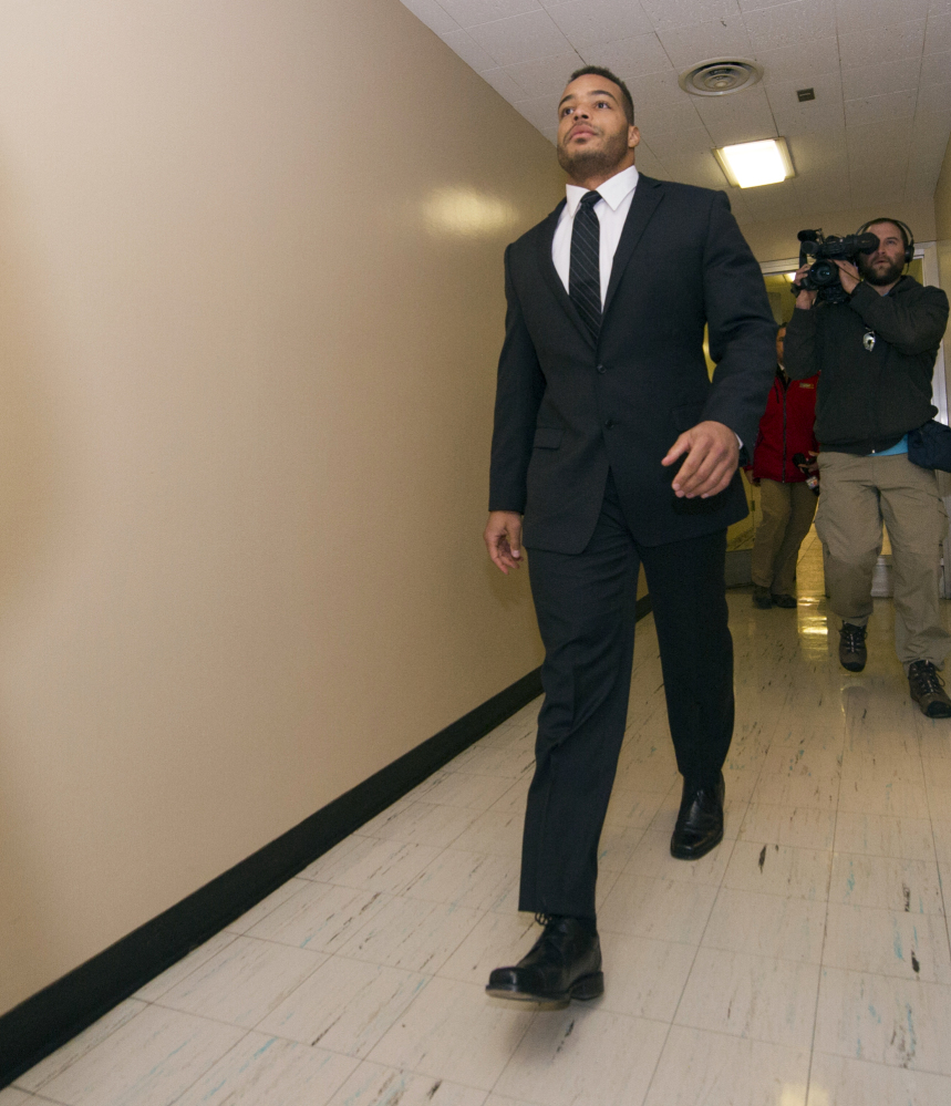 The Indianapolis Colts’ Joshua McNary walks to his initial appearance in Marion County Superior Court in Indianapolis on Thursday. The Colts put McNary on the commissioner’s exempt list Thursday, less than 24 hours after prosecutors charged the backup linebacker with rape, criminal confinement with bodily injury and battery resulting in bodily injury. McNary denied the allegations.