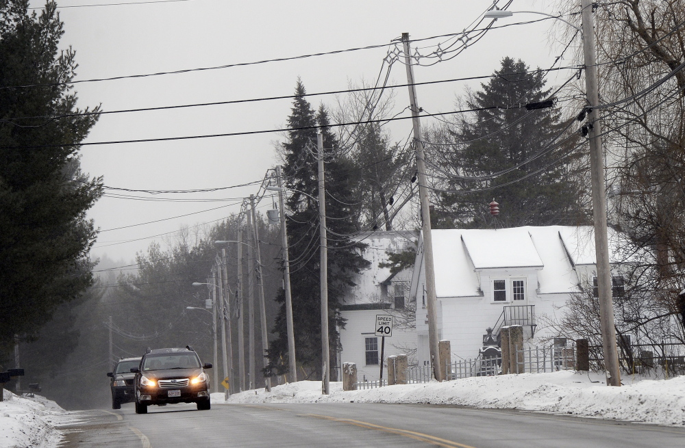 Vehicles make their way down Pequawket Trail in Baldwin, one of five towns in Cumberland County that don’t appear to have taxable nonprofits under the governor’s reform plan.