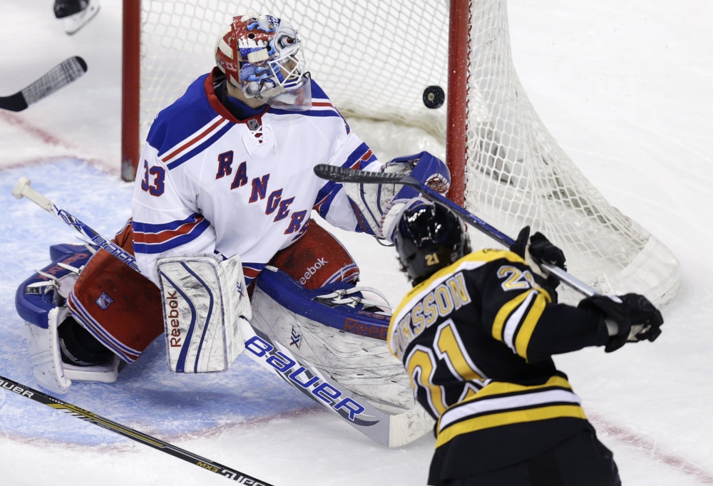 New York Rangers goalie Cam Talbot watches as a shot by Boston Bruins left wing Loui Eriksson passes the post for a goal during the third period of Thursday night’s game in Boston. The goal gave Boston a 3-0 lead.