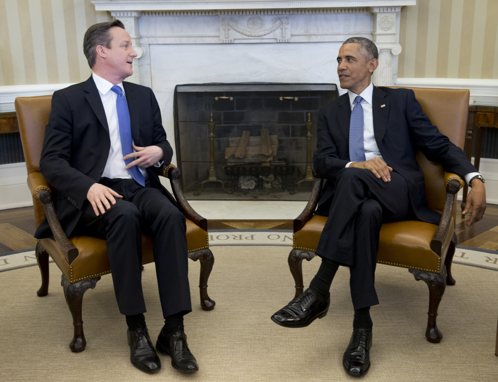 The Associated Press
President Barack Obama meets with British Prime Minister David Cameron on Friday in the Oval Office of the White House in Washington.
