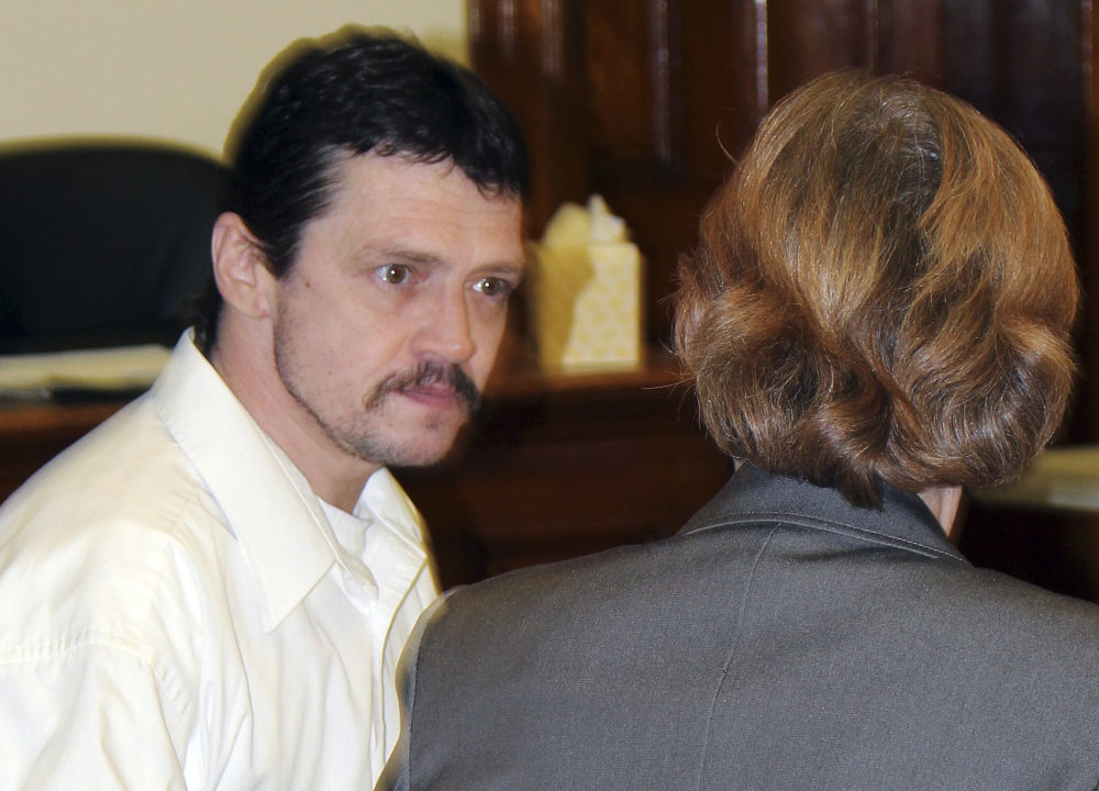 Defendant James Robarge, left, of Saxtons River, Vermont, talks with public defender Caroline Smith during his murder trial this week in Sullivan County Superior Court in Newport, N.H.