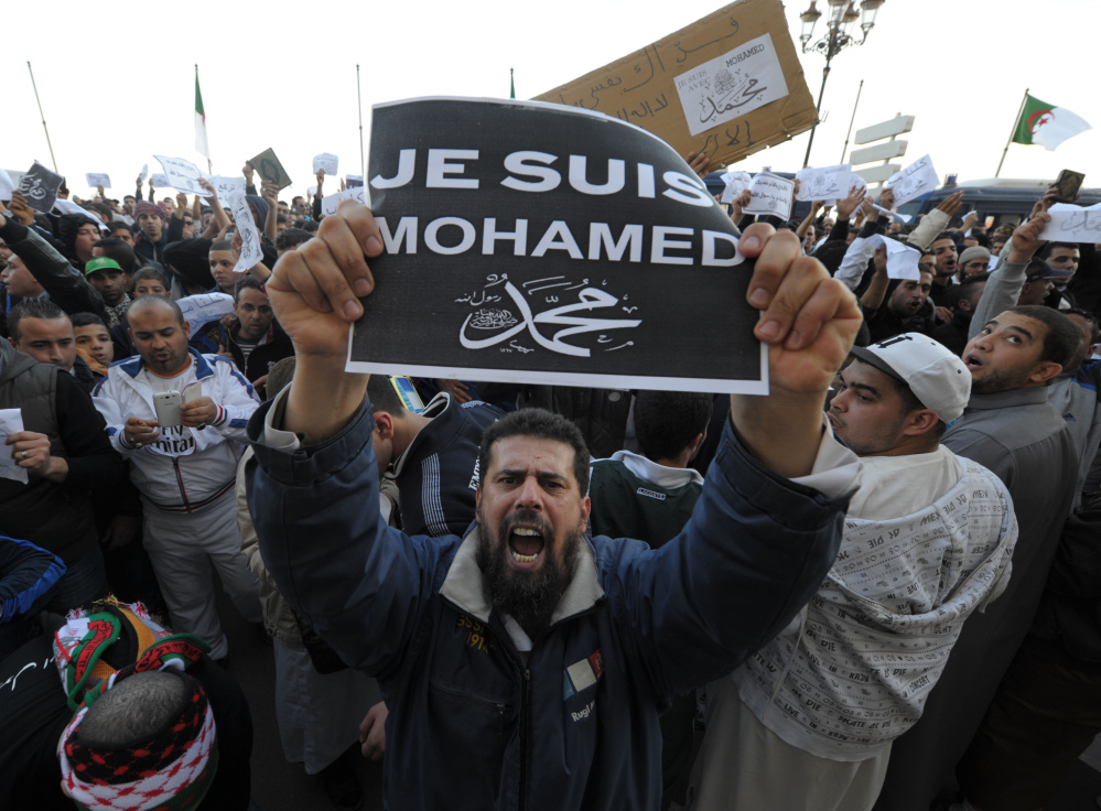 A man expresses his anti-Charlie Hebdo feelings during a protest in Algiers, Algeria, Friday. Elsewhere in Africa, four people died in a protest in the former French colony of Niger.