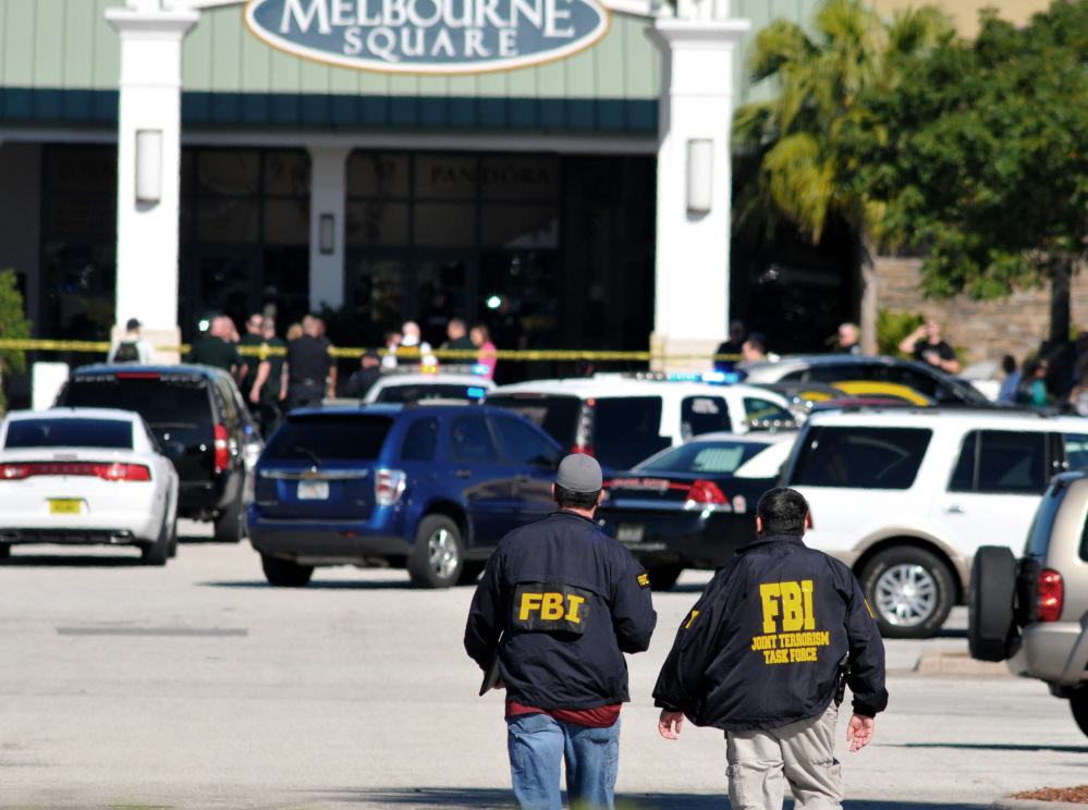 Law enforcement including the FBI respond to the scene of a shooting at the Melbourne Square Mall on Saturday in Melbourne, Fla. Melbourne Police have confirmed that the shooting Saturday morning at the mall has left two people dead and one injured from a gunshot wound.