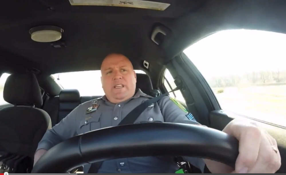 Master Cpl. Jeff Davis enthusiastically lip-syncs to Taylor Swift’s “Shake it Off”’ while driving his patrol car.