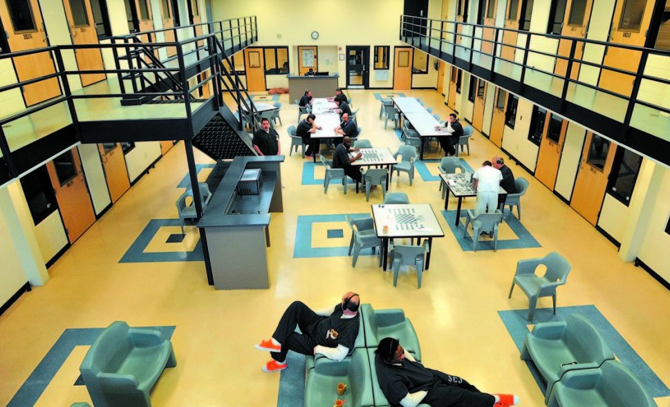 Inmates read and play board games in the day room in the medium security wing at the Somerset County Jail in East Madison. While some jails are crowded, others have room to spare.