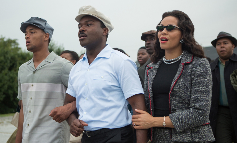 David Oyelowo, center, plays Martin Luther King Jr. and Carmen Ejogo portrays Coretta Scott King in “Selma.”