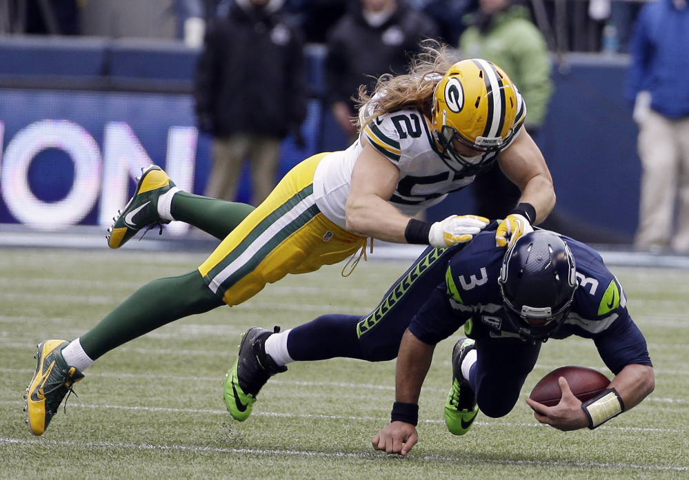 Green Bay Packers’ Clay Matthews sacks Seattle Seahawks’ Russell Wilson in the NFC championship game Sunday in Seattle.