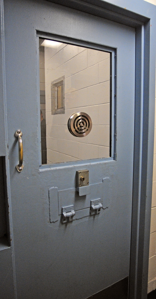 This cell has been modified with a large slot in the door so that meals can be passed in without having to enter it at the Kennebec County Jail in Augusta. County jails in Maine are facing overcrowding and other challenges.