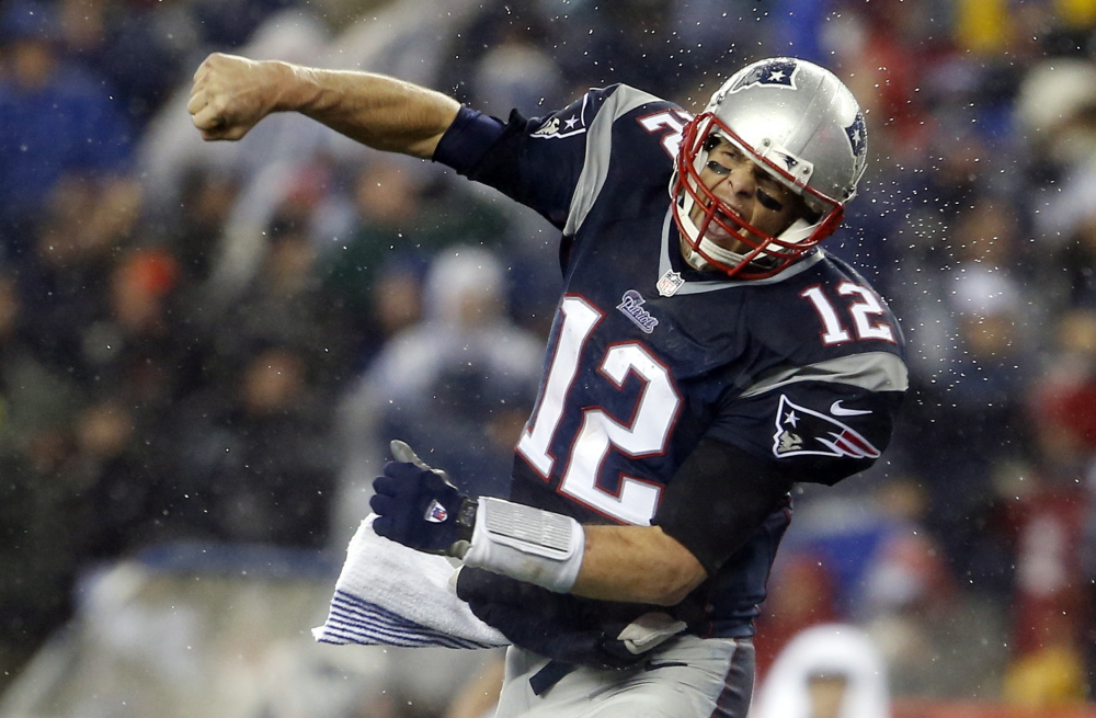 Quarterback Tom Brady celebrates after one of three Patriots touchdowns in the third quarter that put the game away against the Colts at Gillette Stadium. New England won with a combination of a strong running game, tricky formations and an unpredictable pass defense.