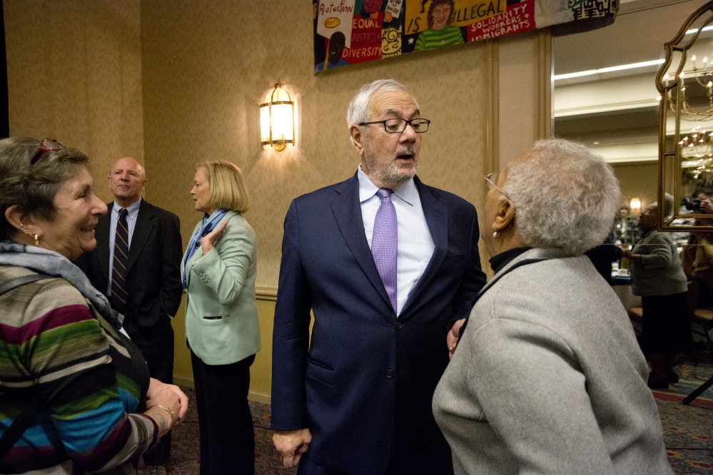 Former U.S. Rep. Barney Frank greets Anita Talbot of Portland after the annual MLK Jr. Day breakfast hosted by the NAACP at the Holiday Inn by the Bay on Monday in Portland.