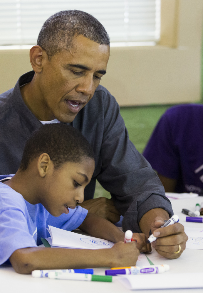 President Obama helps out Monday at the Boys & Girls Club in Washington, D.C.
