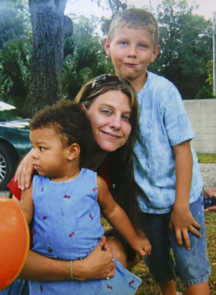 Tracy Veira, shown with her children in 2009, was detoxing from painkillers in a Florida jail when she fell ill and saw a nurse, but was sent back to her cell – and choked to death.