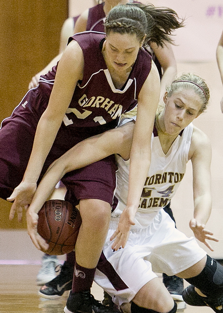 Gorham’s Emily Esposito, who scored a game-high 25 points, fights for the ball with Thornton’s Ashley Howe during the Rams come-from-behind 53-48 win on Monday in Saco.