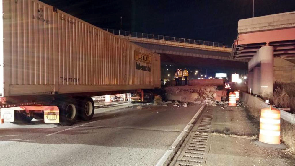 This photo provided by the Cincinnati Fire and EMS, shows the scene following a highway overpass collapse in Cincinnati, Monday.