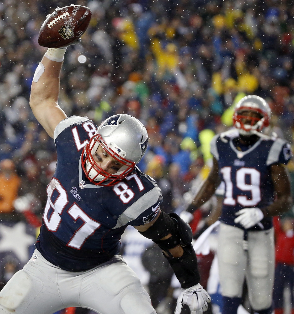 New England tight end Rob Gronkowski prepares one of his monster spikes after catching a touchdown pass during the second half of the Patriots 45-7 AFC title win against the Indianapolis Colts on Sunday at Foxborough, Mass.