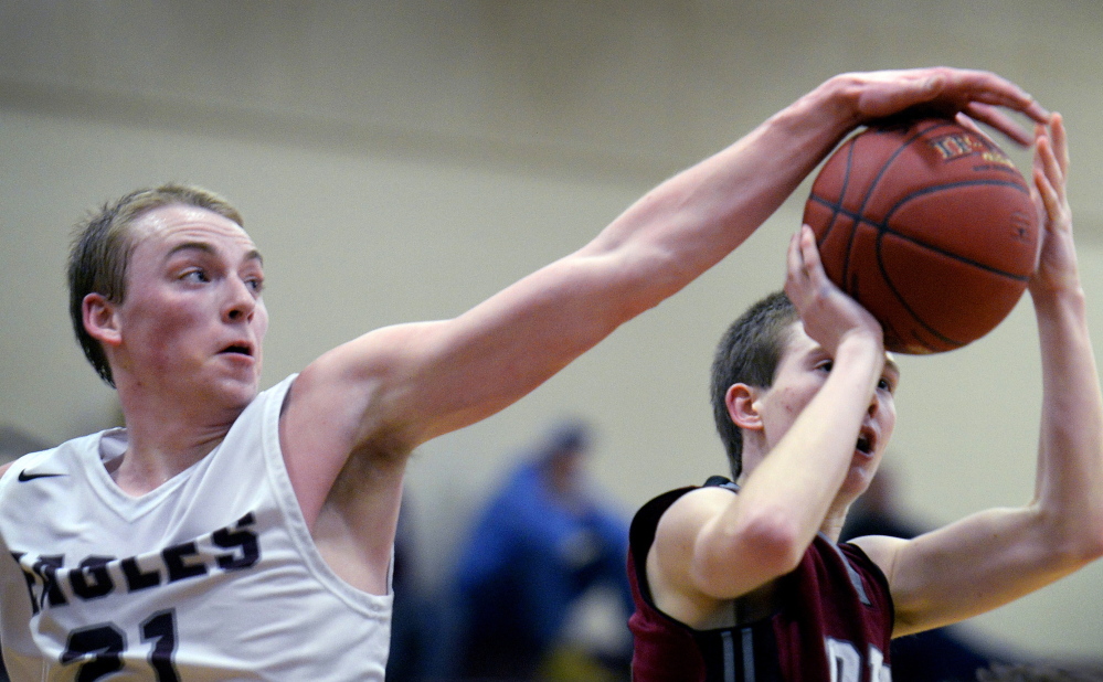 Kevin Weisser of Windham showed his offense Tuesday night, scoring 22 points with three 3-pointers, but also showed his defense by blocking a shot taken by Ben Couture of Noble during Windham’s 60-56 victory in an SMAA game at home.