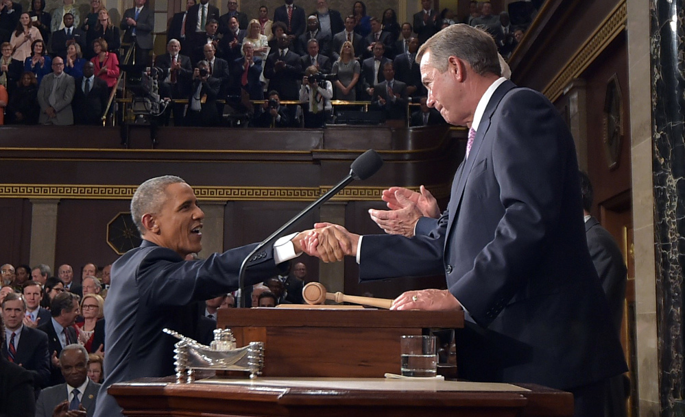 President Obama shakes hands with House Speaker John Boehner before delivering his State of the Union address Tuesday night. Obama reveled in past victories while laying out an aggressive agenda for the next two years.
