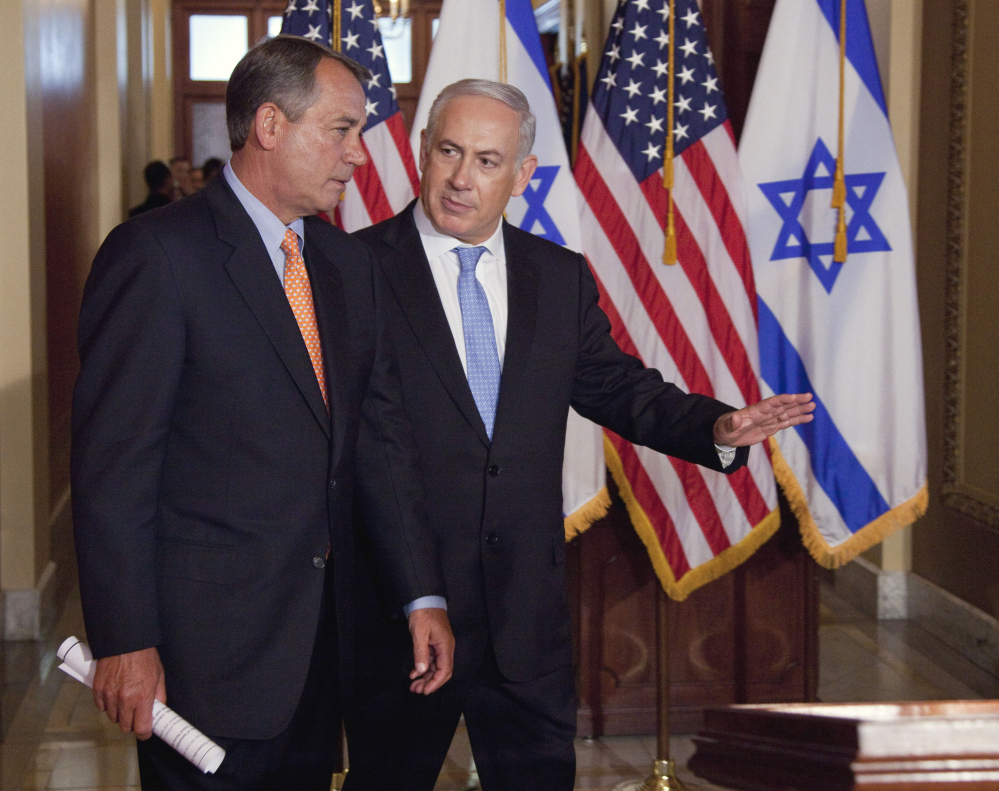 In this 2011 file photo, Israeli Prime Minister Benjamin Netanyahu walks with House Speaker John Boehner to make a statement on Capitol Hill. Boehner has invited Netanyahu to address Congress about Iran next month.