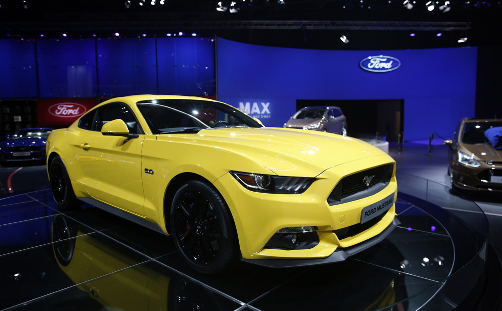 A Ford Mustang is displayed at the Paris Motor Show in October. The engine growl in the Mustang and other brands of America’s best-selling muscle cars and trucks is actually a finely tuned bit of lip-syncing, boosted through special pipes or digitally faked altogether.