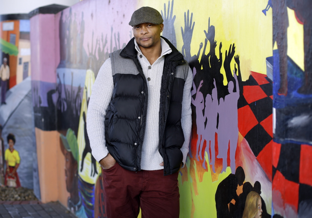 Former Tennessee Titans running back Eddie George poses at an urban improvement project designed and constructed by his landscape and design company, The Edge.