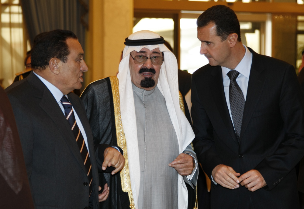 King Abdullah of Saudi Arabia, center, speaks with Egyptian President Hosni Mubarak, left, who served until 2011, and Syrian President Bashar Assad. Saudi state TV reported Friday that King Abdullah has died at the age of 90.