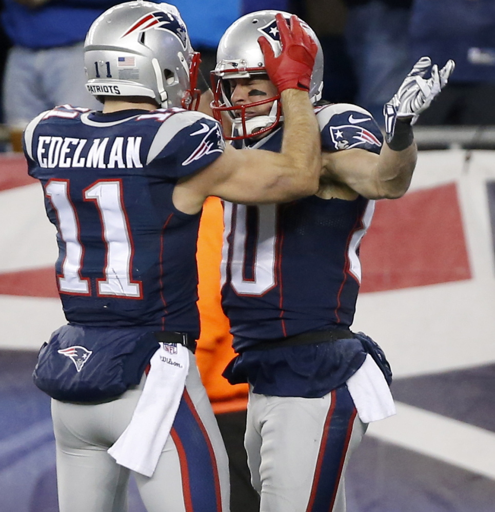 New England receiver Danny Amendola, right, celebrates after catching a crucial touchdown pass from fellow receiver Julian Edelman during the divisional-round victory over Baltimore.