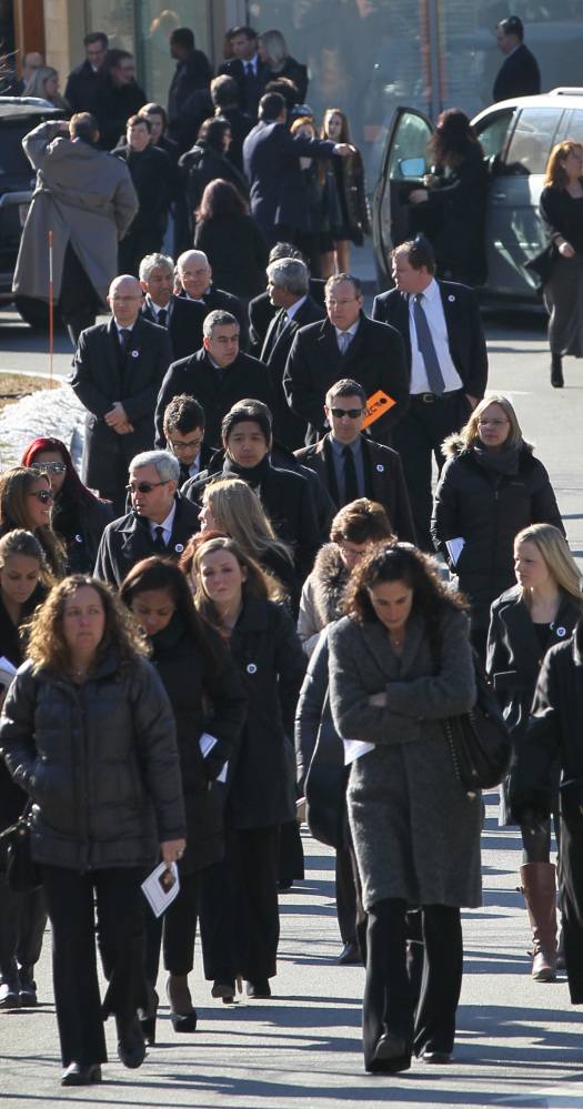 Mourners leave the funeral service for Dr. Michael Davidson on Friday at Temple Beth Elohim in Wellesley, Mass. He was shot Tuesday.