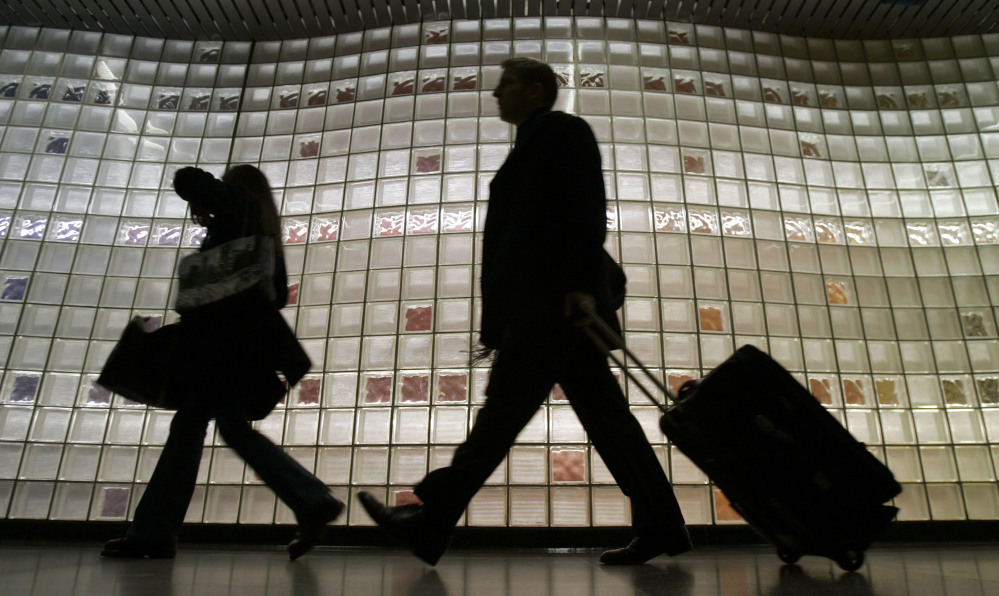 Travelers enter Chicago’s O’Hare International Airport. Indebted to several airlines, the parent company of the shopping catalog SkyMall, an in-flight mainstay since 1989, filed for Chapter 11 protection in U.S. bankruptcy court this week. On Jan. 9, the catalog company took steps to pursue a possible sale.