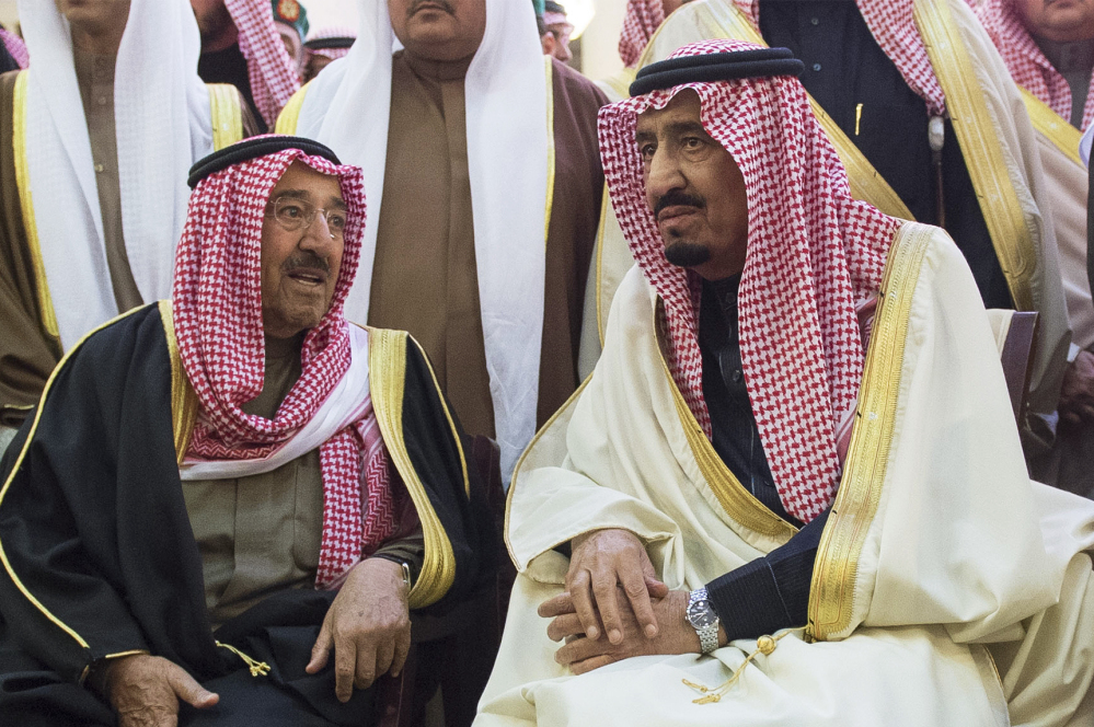 In this photo provided by the Saudi Press Agency, Saudi Arabia’s newly enthroned King Salman, right, talks with Kuwait’s Emir Sheikh Sabah Al-Ahmad Al-Jaber Al-Sabah during the funeral of Salman’s half brother King Abdullah at the Imam Turki bin Abdullah mosque in Riyadh, Saudi Arabia, Friday, Jan. 23, 2015. Saudi state TV reported early Friday that King Abdullah died at the age of 90. (AP Photo/SPA)