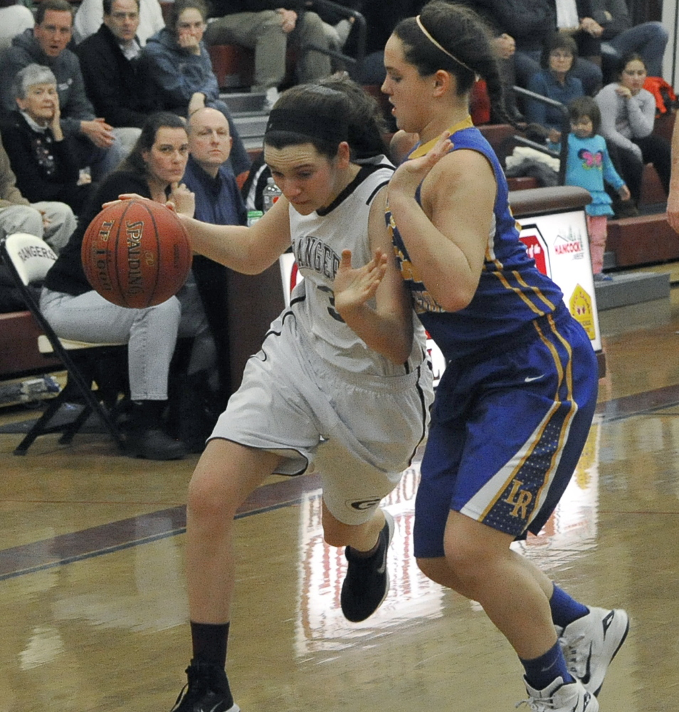 Moira Train of Greely attempts to turn the corner and head to the basket Friday night while guarded by Melody Millett of Lake Region during Greely’s 52-30 victory in a Western Maine Conference game at Cumberland.