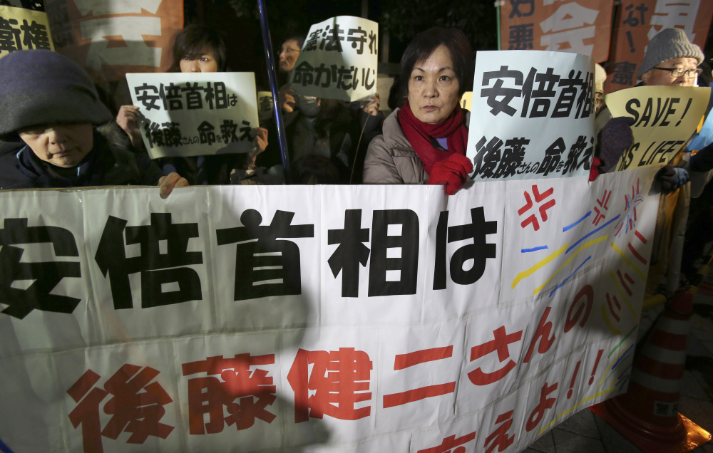 Protesters rally with signs and a banner reading: “Prime Minister Abe, save the life of Kenji Goto!” in front of Prime Minister Shinzo Abe’s official residence in Tokyo on Sunday.