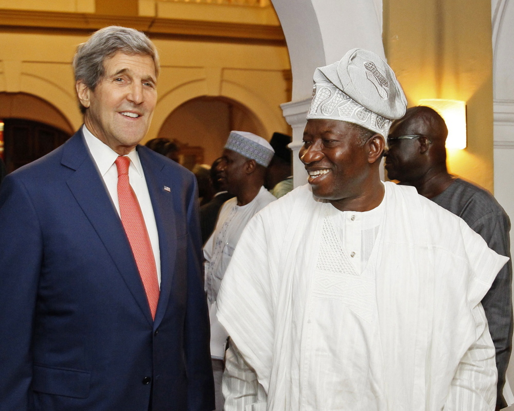 U.S. Secretary of State John Kerry, left, is meeting with Nigeria’s President Goodluck Jonathan in Lagos, Nigeria, to urge a peaceful election on Feb. 14.