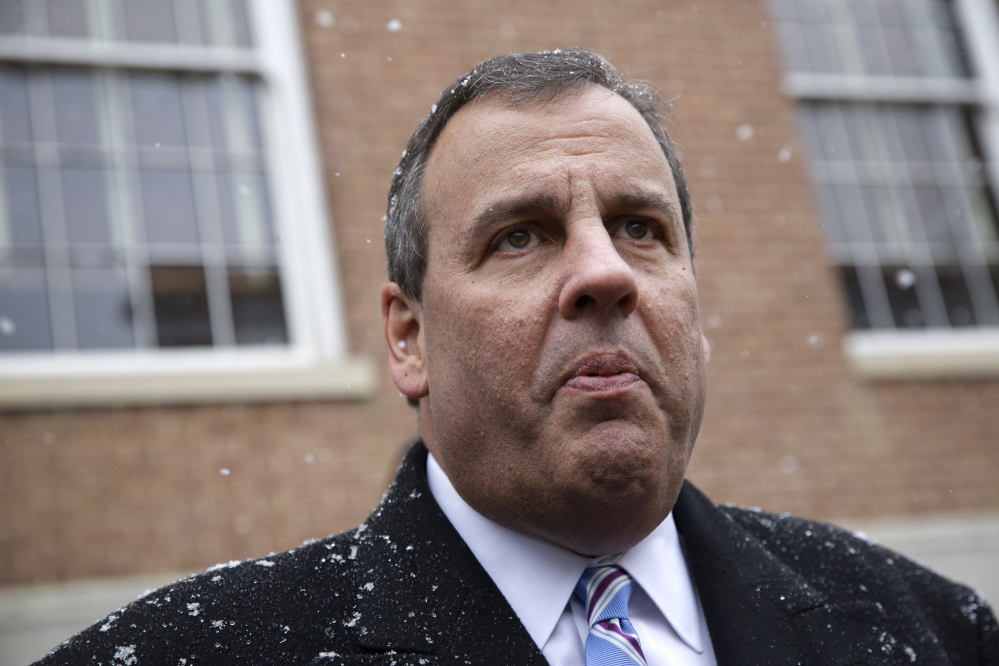 New Jersey Gov. Chris Christie speaks with reporters as he leaves after an inaugural ceremony for Maryland Gov. Larry Hogan, Wednesday in Annapolis, Md.